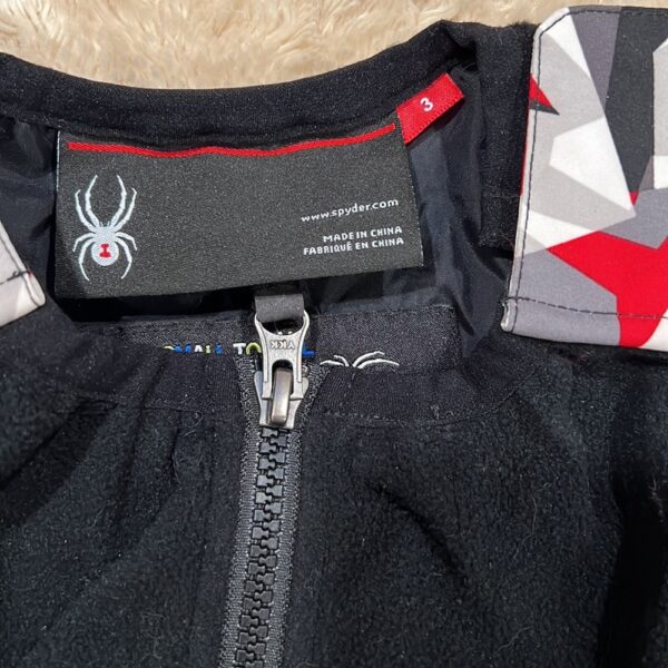 Pr of Spyder snowbibs, red, white, and black, sz 3