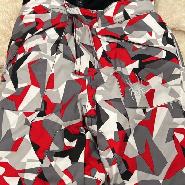 Pr of Spyder snowbibs, red, white, and black, sz 3