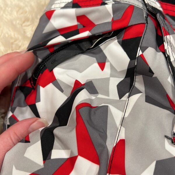 Pr of Spyder snowbibs, red, white, and black, sz 3