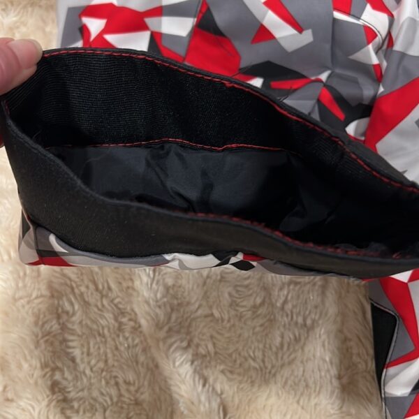 Pr of Spyder snowbibs, red, white, and black, sz 3