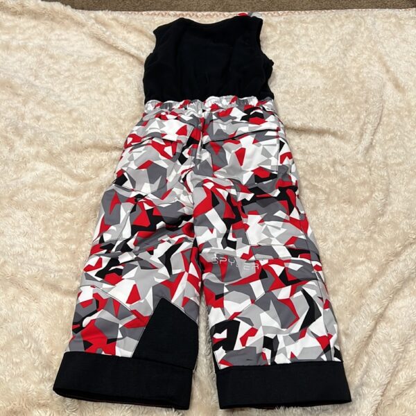 Pr of Spyder snowbibs, red, white, and black, sz 3