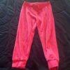 Pair of girl’s pink velour sweatpants by Juicy Couture, size 4/5