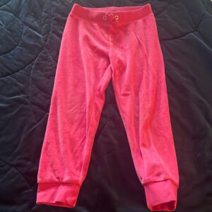 Pair of girl’s pink velour sweatpants by Juicy Couture, size 4/5