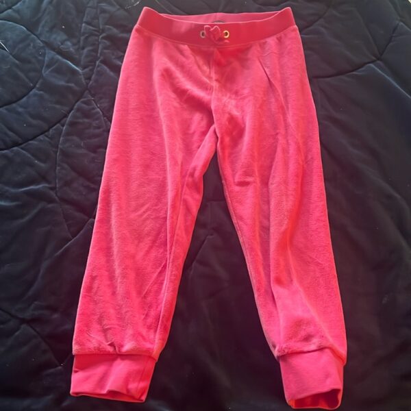 Pair of girl’s pink velour sweatpants by Juicy Couture, size 4/5