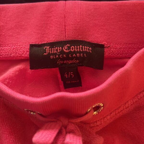 Pair of girl’s pink velour sweatpants by Juicy Couture, size 4/5
