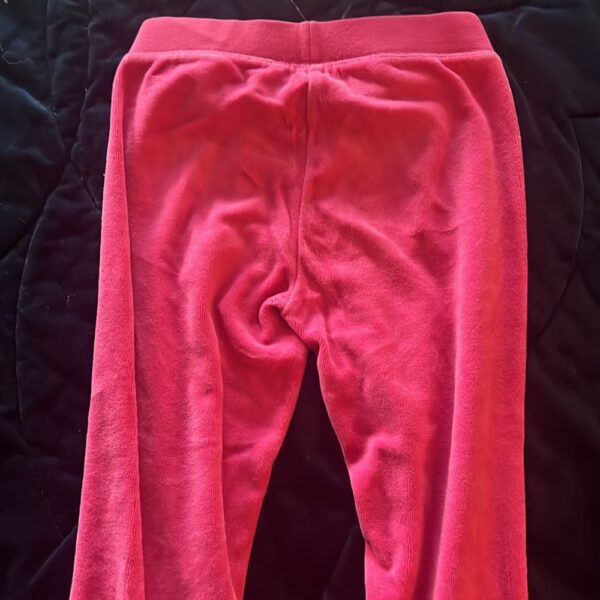 Pair of girl’s pink velour sweatpants by Juicy Couture, size 4/5