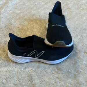 New Balance, like new, pair of black slip on sneakers, size 3