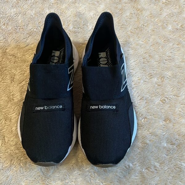 New Balance, like new, pair of black slip on sneakers, size 3