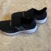 New Balance, like new, pair of black slip on sneakers, size 3