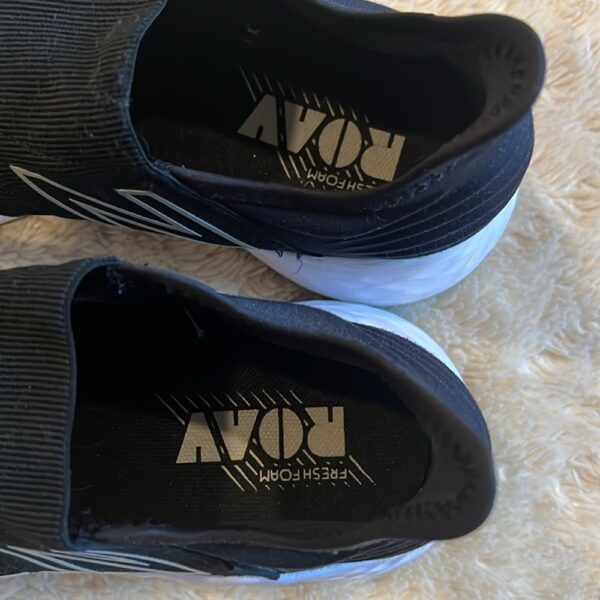 New Balance, like new, pair of black slip on sneakers, size 3