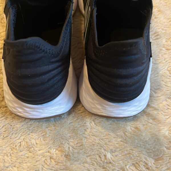 New Balance, like new, pair of black slip on sneakers, size 3