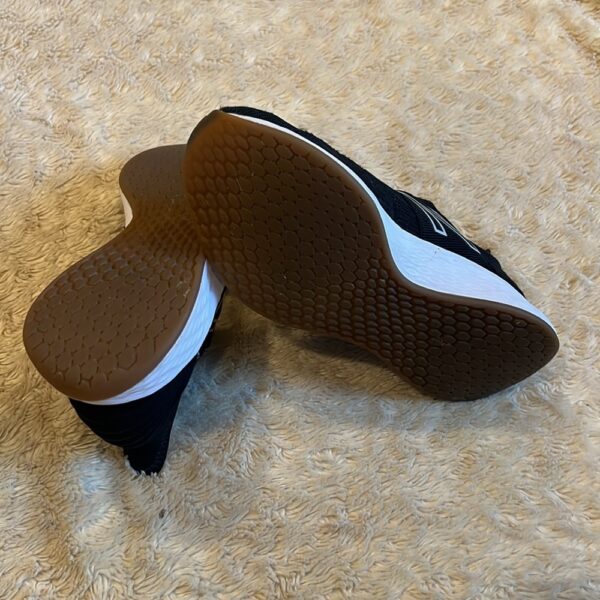 New Balance, like new, pair of black slip on sneakers, size 3