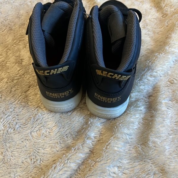 Sketchers, pr of black rechargeable light up shoes, size 1